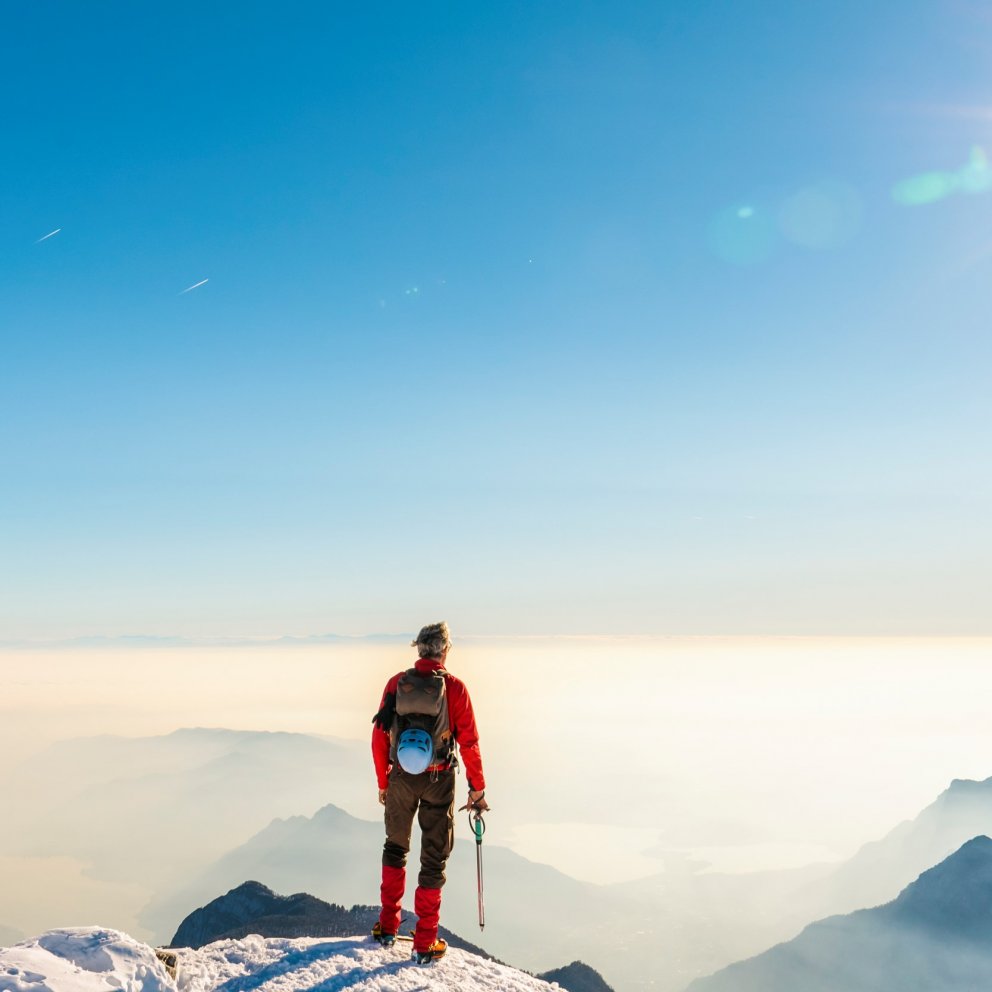 Climber on top mountain